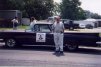 Allen Danziger standing in front of one of his restored cars.