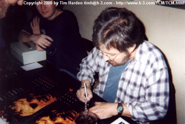 Tobe autographing my poster.